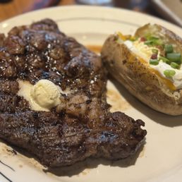 Juiciest steak ever with a loaded baked potato. Juiciest steak ever with a loaded baked potato.