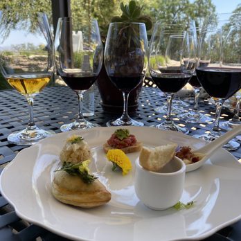 Le Cuvier Winery - a plate of food and wine glasses - Wineries Near Me - Paso Robles, California Le Cuvier Winery - a plate of food and wine glasses - Wineries Near Me - Paso Robles, California