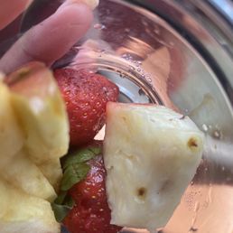 The fruit cup with mold on the strawberries The fruit cup with mold on the strawberries