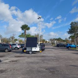 Solar security cameras stationed in the parking lot