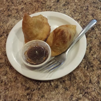 Bombay Curry - Samosas- come as a pair.   Spicy potato dumpling in dough shell and served with yogurt chatni. - Indian Near Me - Melbourne, Florida