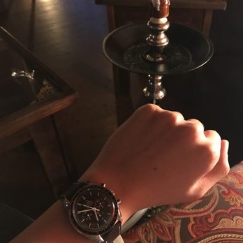 Arabia Café & Hookah Lounge - a person holding a watch - Coffee & Tea Near Me - Chicago, Illinois Arabia Café & Hookah Lounge - a person holding a watch - Coffee & Tea Near Me - Chicago, Illinois