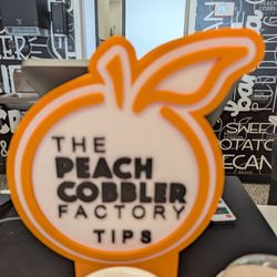 The Peach Cobbler Factory - Logo