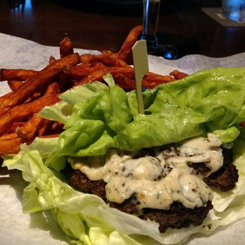 Yard House - Truffle cheese Burger lettuce wrapped with sweet potato fries. - New American Near Me - Austin, Texas Yard House - Truffle cheese Burger lettuce wrapped with sweet potato fries. - New American Near Me - Austin, Texas