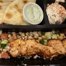 Chicken Kabob Plate with chickpea salad, hummus, and pita.