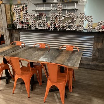 Thailand Modern Eatery - a table with orange chairs - Thai Near Me - Providence, Rhode Island Thailand Modern Eatery - a table with orange chairs - Thai Near Me - Providence, Rhode Island