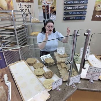 Great Harvest Bread Company - Staff showing gluten free breakfast bars - Bakeries Near Me - Clackamas, Oregon