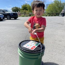 East Palo Alto Farmers Market - my little helper turning in our compost bin for veggie cash!