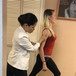 Carmichael Spinal Care - Dr.Nguyen is showing stretches