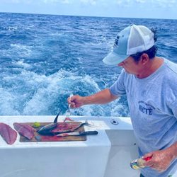 Charter Fishing Cancún- Premium Fishing Charters In Cancun  - Our mate cooking tuna