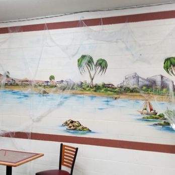 La Michoacana De Paquime - a table and chairs in front of a mural - Desserts Near Me - Albuquerque, New Mexico La Michoacana De Paquime - a table and chairs in front of a mural - Desserts Near Me - Albuquerque, New Mexico