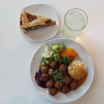 IKEA - Apple "cake" at top; lemon water. On the plate, clockwise: mixed veggies, mashed potatoes and gravy, meatballs with lingonberry jam. - Scandinavian Near Me - Frisco, Texas