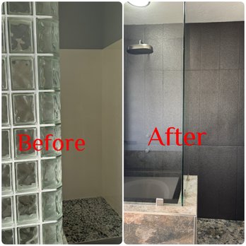 Marshall Renovations - Shower stall before & after Reno - The image displays two side-by-side photos of a shower stall, with the left labeled 'Before' and the right labeled 'After.' The 'Before' photo shows a shower with a glass block wall and pebble tile flooring, while the 'After' photo features a sleek, textured black wall with a glass partition and a different stone-like base. The renovation highlights a transformation in style and materials used in the shower space. - General Contractors Near Me