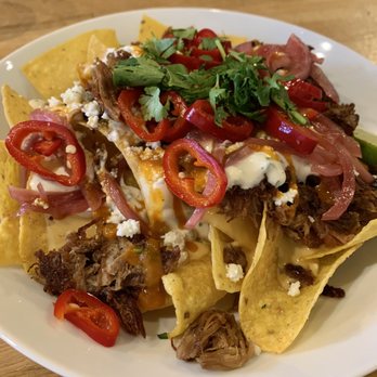 Nine Giant Brewing - Loaded Nachos. Great flavors and textures. Big enough to share as an appetizer for 2-4 or as an entree. - Gastropubs Near Me - Cincinnati, Ohio Nine Giant Brewing - Loaded Nachos. Great flavors and textures. Big enough to share as an appetizer for 2-4 or as an entree. - Gastropubs Near Me - Cincinnati, Ohio