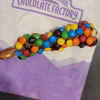 Rocky Mountain Chocolate Factory - M&M Carmel Pretzel - Chocolatiers & Shops Near Me - Bloomington, Minnesota