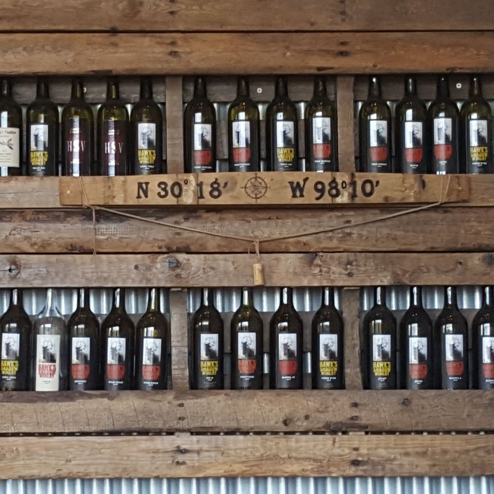 Hawk's Shadow Winery - Wines on display inside the tasting room - Wineries Near Me - Dripping Springs, Texas