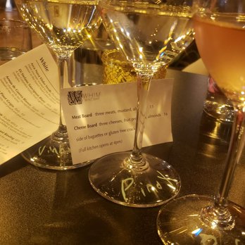 Whim Wine Bar - three glasses of wine on a bar - Beer Bar Near Me - Spokane, Washington
