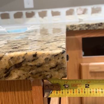 Elite Granite Tops - FIRST install- overhang to right of the oven does not match other side of oven, neither is 1.5" - Countertop Installation Near Me - Colorado Springs, Colorado Elite Granite Tops - FIRST install- overhang to right of the oven does not match other side of oven, neither is 1.5" - Countertop Installation Near Me - Colorado Springs, Colorado