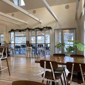 Amelia's - a dining room with tables and chairs - Bakeries Near Me - Indianapolis, Indiana