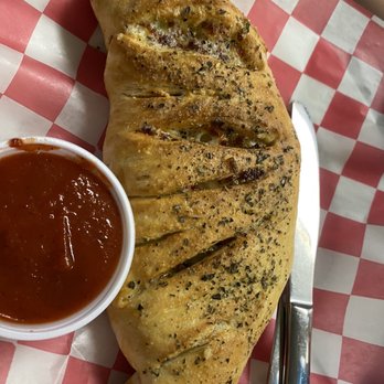 The Feeder Restaurant - Calzone with marinara on the side. - Burgers Near Me - Horse Cave, Kentucky The Feeder Restaurant - Calzone with marinara on the side. - Burgers Near Me - Horse Cave, Kentucky