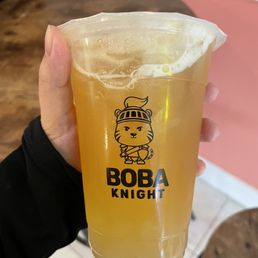 a person holding a glass of beer a person holding a glass of beer