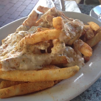 Ugly Mug - Old Bay seasoning. Mild cheese sauce & crab meat poured on top of steak fries. - Beer, Wine & Spirits Near Me - Cape May, New Jersey Ugly Mug - Old Bay seasoning. Mild cheese sauce & crab meat poured on top of steak fries. - Beer, Wine & Spirits Near Me - Cape May, New Jersey
