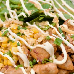 Grilled chicken rice bowl,  with corns, tender greens. $10.99