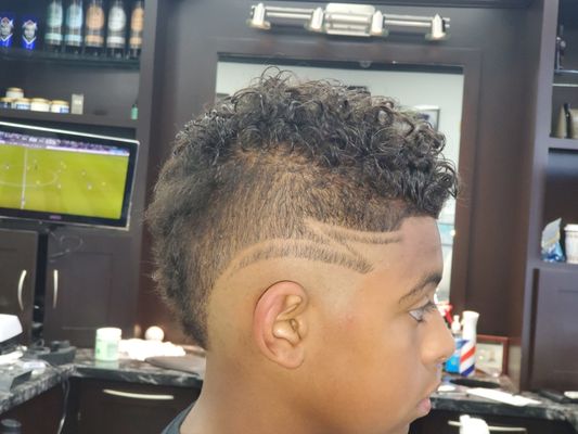 Kids (under 13) - 🧒 Classic & Clean Cut
Expertly crafted buzz cuts, crew cuts, and short fades—ideal for school-ready styles that stay neat and easy. Sharp lines, smooth blends, and comfy trims.
🎨 Creative Kid Styles
Bold line-ups, side parts, or playful designs—a tiny pop of creativity to showcase your child’s personality and style preferences.
🌟 Gentle & Smooth Experience
Kid-approved atmosphere—calm, friendly, and fast-paced. Barbers use soft voices and quick techniques to keep the haircut fun and stress-free.
👨👦 Family-Friendly Care
Special attention to little ones: lap-holds, short wait times, and encouraging words—perfect for first-time cut jitters. Follow-up trim advice to keep the style looking fresh at home.
🎯 Why Choose Us for Kids' Cuts?
Patience-focused—experienced in working with younger clients to ensure comfort and confidence.
Detail-driven—every snip is precise, giving even simple styles crisp finishes.
Kid-tested, parent-approved—booking is easy, and check-ins are smooth. Colorful capes, supportive barbers, and always a friendly greeting.
📅 Ready for a Sharp Look?
Book your child’s haircut now—whether it’s back-to-school, a first communion, or just a fresh summer cut! Call (480) 793‑0012, book online, or walk in. Let your kiddo rock a haircut that’s easy, stylish, and built to last. Kids (under 13) - 🧒 Classic & Clean Cut
Expertly crafted buzz cuts, crew cuts, and short fades—ideal for school-ready styles that stay neat and easy. Sharp lines, smooth blends, and comfy trims.
🎨 Creative Kid Styles
Bold line-ups, side parts, or playful designs—a tiny pop of creativity to showcase your child’s personality and style preferences.
🌟 Gentle & Smooth Experience
Kid-approved atmosphere—calm, friendly, and fast-paced. Barbers use soft voices and quick techniques to keep the haircut fun and stress-free.
👨👦 Family-Friendly Care
Special attention to little ones: lap-holds, short wait times, and encouraging words—perfect for first-time cut jitters. Follow-up trim advice to keep the style looking fresh at home.
🎯 Why Choose Us for Kids' Cuts?
Patience-focused—experienced in working with younger clients to ensure comfort and confidence.
Detail-driven—every snip is precise, giving even simple styles crisp finishes.
Kid-tested, parent-approved—booking is easy, and check-ins are smooth. Colorful capes, supportive barbers, and always a friendly greeting.
📅 Ready for a Sharp Look?
Book your child’s haircut now—whether it’s back-to-school, a first communion, or just a fresh summer cut! Call (480) 793‑0012, book online, or walk in. Let your kiddo rock a haircut that’s easy, stylish, and built to last.