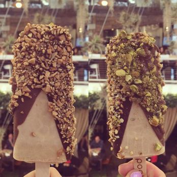 Popbar - Hazelnut bar covered in 1/2 milk chocolate & 1/2 dark chocolate with pistachio and hazelnut toppings :) - Desserts Near Me - Anaheim, California Popbar - Hazelnut bar covered in 1/2 milk chocolate & 1/2 dark chocolate with pistachio and hazelnut toppings :) - Desserts Near Me - Anaheim, California