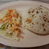 Photo of Lupita's Restaurant - Costa Mesa, CA, United States. Pupusa revuelta ($2.25), served with slaw