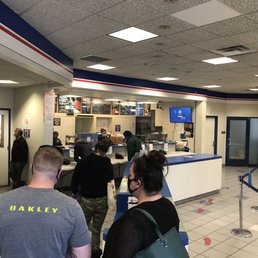 Front desk employees with no customers and aren't handling the overflow of people picking up packages.