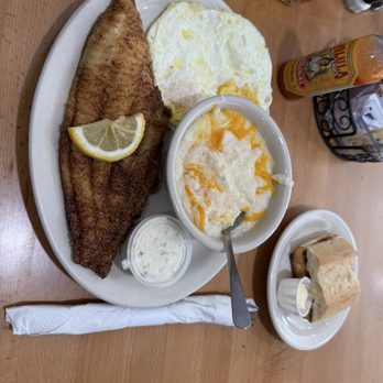 Himes Breakfast House - Fried catfish, medium fried egg, cheese grits, and Cuban toast. - Breakfast & Brunch Near Me - Brandon, Florida Himes Breakfast House - Fried catfish, medium fried egg, cheese grits, and Cuban toast. - Breakfast & Brunch Near Me - Brandon, Florida