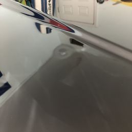 Nickel Size dent on car hood Nickel Size dent on car hood