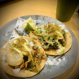 Cabeza and Carnitas tacos came stuffed Cabeza and Carnitas tacos came stuffed