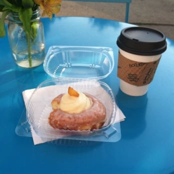 Montclair Bread Company - peaches and cream donut w/ regular small coffee on their fun colored outdoor table - Bakeries Near Me - Montclair, New Jersey Montclair Bread Company - peaches and cream donut w/ regular small coffee on their fun colored outdoor table - Bakeries Near Me - Montclair, New Jersey
