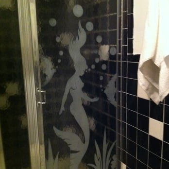 Ocean Vista Resort - Room 215. Mermaids on the shower doors. Be careful when taking a shower, the showerheads might scalp you. - Resorts Near Me - Amagansett, New York