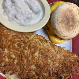 Sausage, cheese muffin, hash browns and gravy Sausage, cheese muffin, hash browns and gravy