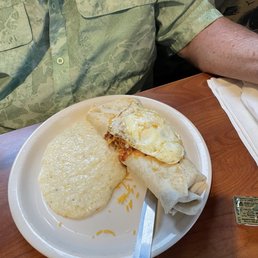 Breakfast Burrito with fried egg and grits Breakfast Burrito with fried egg and grits