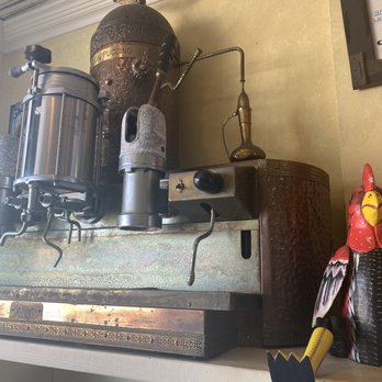 Gator Joes - a coffee grinder and a chicken figurine - Coffee & Tea Near Me - Key West, Florida