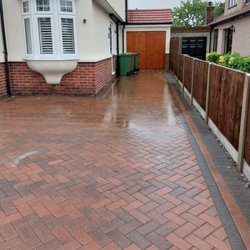 C N J Paving - Ponding against house.