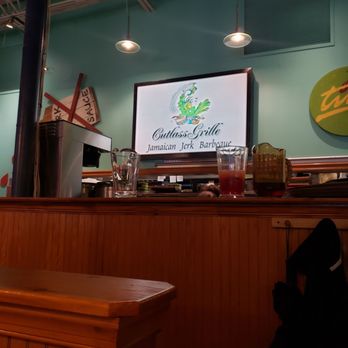 Cutlass Grille - Cutlass Grille logo in the dining area - Caribbean Near Me - Chesapeake, Virginia