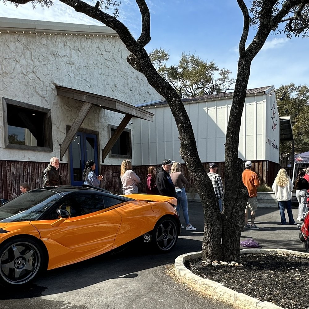 Hoodoo Crawfish - a yellow sports car parked in front of a building - Caterers Near Me