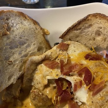 Riser Tavern and Grill - Brunch Bowl. Two eggs, potatoes, bacon, sausage, onions, peppers, and cheese. Served with two slices of crusty bread. - Pubs Near Me - Youngstown, Ohio Riser Tavern and Grill - Brunch Bowl. Two eggs, potatoes, bacon, sausage, onions, peppers, and cheese. Served with two slices of crusty bread. - Pubs Near Me - Youngstown, Ohio