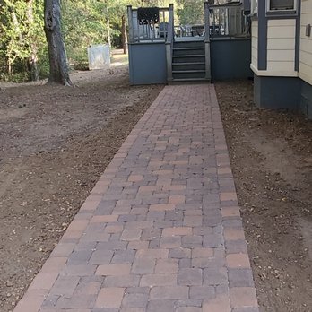 RcTex Pavers & Hardscapes - Block design and layout adds dimension to a long walkway to the back of our house. - Masonry/Concrete Near Me - Austin, Texas RcTex Pavers & Hardscapes - Block design and layout adds dimension to a long walkway to the back of our house. - Masonry/Concrete Near Me - Austin, Texas