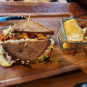 Finney's Crafthouse - Burbank - Norwegian Salmon Sandwich which comes with side of chips - New American Near Me - Burbank, California