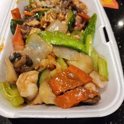 New China - Ginger beef with chicken mix dish and cashew shrimp dish, and crispy noodles, ready to take home, after a filling serving.
