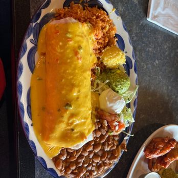 Chevys Fresh Mex - smothered burrito, stuffed with picadillo, beef and rice covered in delicious queso - Mexican Near Me - Olivette, Missouri Chevys Fresh Mex - smothered burrito, stuffed with picadillo, beef and rice covered in delicious queso - Mexican Near Me - Olivette, Missouri