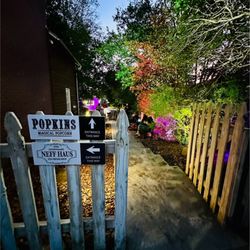Popkins Magical Popcorn - Lighted yard in evening