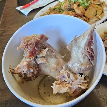 Phnom Penh Noodle Shack - Student Noodles accompanying bowl of bone broth soup with a huge Pork bone - Cambodian Near Me - Long Beach, California Phnom Penh Noodle Shack - Student Noodles accompanying bowl of bone broth soup with a huge Pork bone - Cambodian Near Me - Long Beach, California