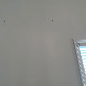 Handymanz - Several holes trying to find stud instead of using stud finder. - Handyman Near Me Handymanz - Several holes trying to find stud instead of using stud finder. - Handyman Near Me